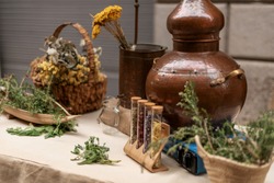 Herbal bench and old copper essential oil distiller