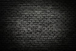 Old brick black color wall. Vintage background