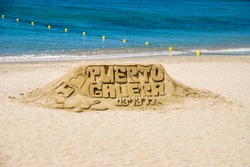 Photograph of sculpture made of sand, taken at White beach of Puerto Galera in province of Oriental Mindoro, Philippines . Sculptures of mermaids made of sand by the sea.