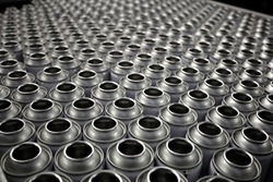 empty steel aerosol cans in factory awaiting production process