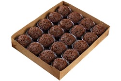 Box with several brigadeiros lined up. Brazilian traditional sweet_whitebackground.