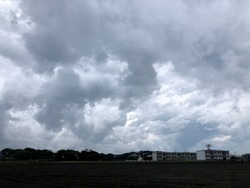 Atmosphere of overcast dusk sky before to rainy over the land and building.Natural gloomy sky weather background. Dramatic storm cloudy and dark sky. Dark clouds sky.