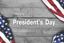 Happy presidents day Vintage style with flag of the United States on wooden background.
