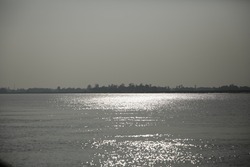 Sun reflection on water - Water waves with sparkling light - Sun glints at Bhitarkanika National Park