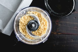 Making Buttery Pastry Crust in a Food Processor: Overhead view of flour, butter, and sugar mixed in a food processor