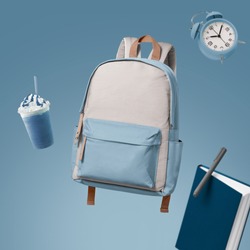 School bag floating with school items advertising photography by