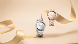 Luxury women watches floating on ribbom on seamless background concept