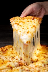 Pizza with very much cheese melting