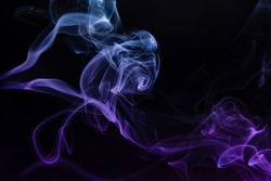 Abstract colored smoke hookah on dark background. Texture. Art Design element. Personal vaporizers fragrant steam. Concept of alternative non-nicotine smoking. E-cigarette. Evaporator.