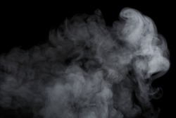 Abstract white water vapor on a black background. Texture. Design elements. Abstract art. Steam the humidifier. Macro shot.