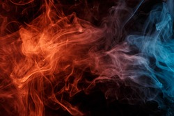 Abstract smoke Weipa. Personal vaporizers fragrant steam. The concept of alternative non-nicotine smoking. Orange turquise smoke on a black background. E-cigarette. Evaporator. Taking Close-up. Vaping