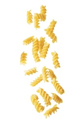 Spirals dried pasta on a white isolated background. toning. selective focus