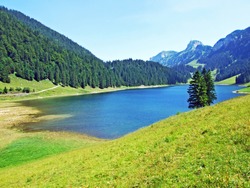 Alpine lake Sämtisersee (Samtisersee or Saemtisersee) in mountain range Alpstein and the Appenzellerland region - Canton of Appenzell Innerrhoden, Switzerland