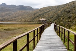 Cotopaxi National Park. Observation deck and wooden walkway at lake Limpiopungo on an overcast rainy day. Cotopaxi province, Ecuador