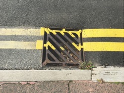 Newly painted double yellow lines on road surface