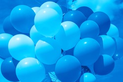 Color of 2020 year, classic blue. Group of balloons with helium on the sky background. Trend color