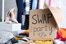 Swap party. Event for the exchange. Casual clothes on hangers, shoes, hats, bags. Reduce and reuse concept. Idea of exchange your old wardrobe for new. Eco-friendly cloth exchange, donation