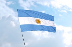 Flag of Argentina in front of blue sky
