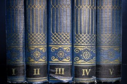 Books bindings background. Old books with blue cover. Volumes of vintage books