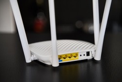 Side view of a modern WI-FI router for home usage with 4 antennas