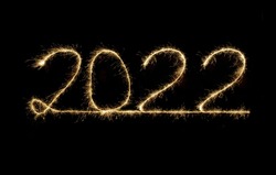 2022 written with Sparkle firework on black background written horizontally, happy new year 2022 concept.