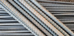 Steel bars with rust close- up background,Steel reinforcement folded on the construction site.The texture of the steel reinforcement