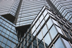 close up of modern skyscraper / abstract building background / glass reflection