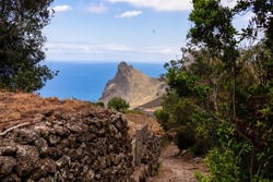 Scenic hiking trail leading to village Taganana with view on Roque de las Animas crag in the Anaga mountain range, north coast of Tenerife, Canary Islands, Spain, Europe. Path from Afur to Taganana