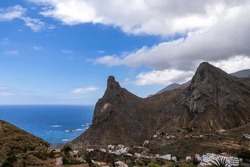 Panoramic view on Roque de las Animas crag and Roque en Medio in the Anaga mountain range, north coast of Tenerife, Canary Islands, Spain, Europe. Hiking trail from Afur to Taganana. Atlantic Ocean