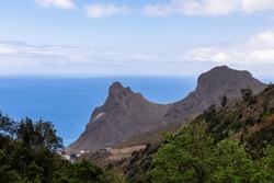 Panoramic view on Roque de las Animas crag and Roque en Medio in the Anaga mountain range, north coast of Tenerife, Canary Islands, Spain, Europe. Hiking trail from Afur to Taganana. Atlantic Ocean