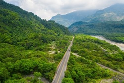 Bird eye view of Taiwan valley -Aerial view and colorful landscape with sky, cloud, hill, river,valley and road; use the drone in morning, shot in Namasia, Kaohsiung, Taiwan.