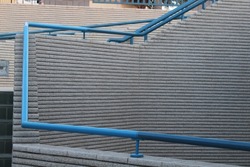 Blue Rail Stairways with concrete steps.
