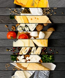 Top view of various kinds of cheese abstract mix with spice and herbs on gray slate surface