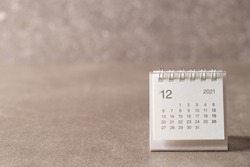 December 2021 calendar on gray background