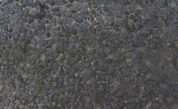 Texture background gravel floor. Cobbled surface with paving stones in different shades top view Natural stone pavement Exterior floor covering. Pathway. Photo concept. Ideal for design and for text.