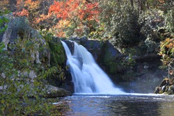 Abrams Falls flow in The Great Smoky Mountain National Park during autumn foliage near Cades Cove, Tennessee.