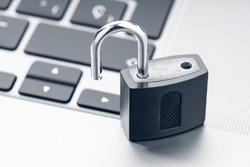 Open padlock on modern laptop. Computer Security Vulnerability concept