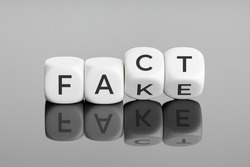 Fact or Fake concept. Flip blocks change the word fake to fact. April fools day