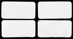 Set of four crumpled paper sheets, each of which is isolated on black background. Rectangle shape has rounded edges. Template mockup