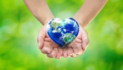 Earth Heart in Hands on Green Blurred Nature background, World Environment Day and Give Love to Our  World Concept, Elements of this image furnished by NASA