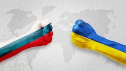 Flags of Ukraine and Russia Flag on hands punch to each others on light gray world map background, Ukraine vs Russia in world war crisis concept
