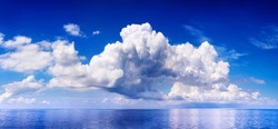 White cumulus clouds in sky over blue sea water landscape, big cloud above ocean panorama, horizon, beautiful tropical sunny summer day seascape panoramic view, cloudy weather, cloudscape, copy space