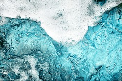 White foam clear blue water background closeup, sea or ocean foam wave border, froth bubbles texture, lather backdrop, soap suds pattern, soapy detergent, foamy bath surface, shower, clean and wash 