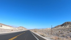 Drive through Death Valley National Park in California, USA. Desert road in Death Valley.
