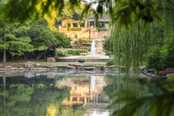 Tranquil pond with reflections at Fort Worth Botanical Garden
