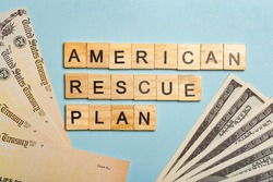 USA dollars background. American rescue plan, USA relief program, stimulus check and Act of 2021 concept. Money, business, profit and livelihood idea