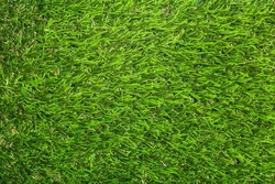 Artificial turf background. Green artificial plastic grass to cover the floor or ground
