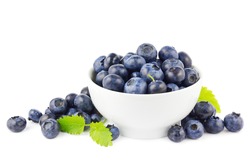 Beautiful fresh blueberries in a white bowl on a white background