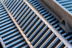 Galvanised steel gratings on channel drain sections