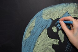 drawing of planet earth with chalk on a blackboard
